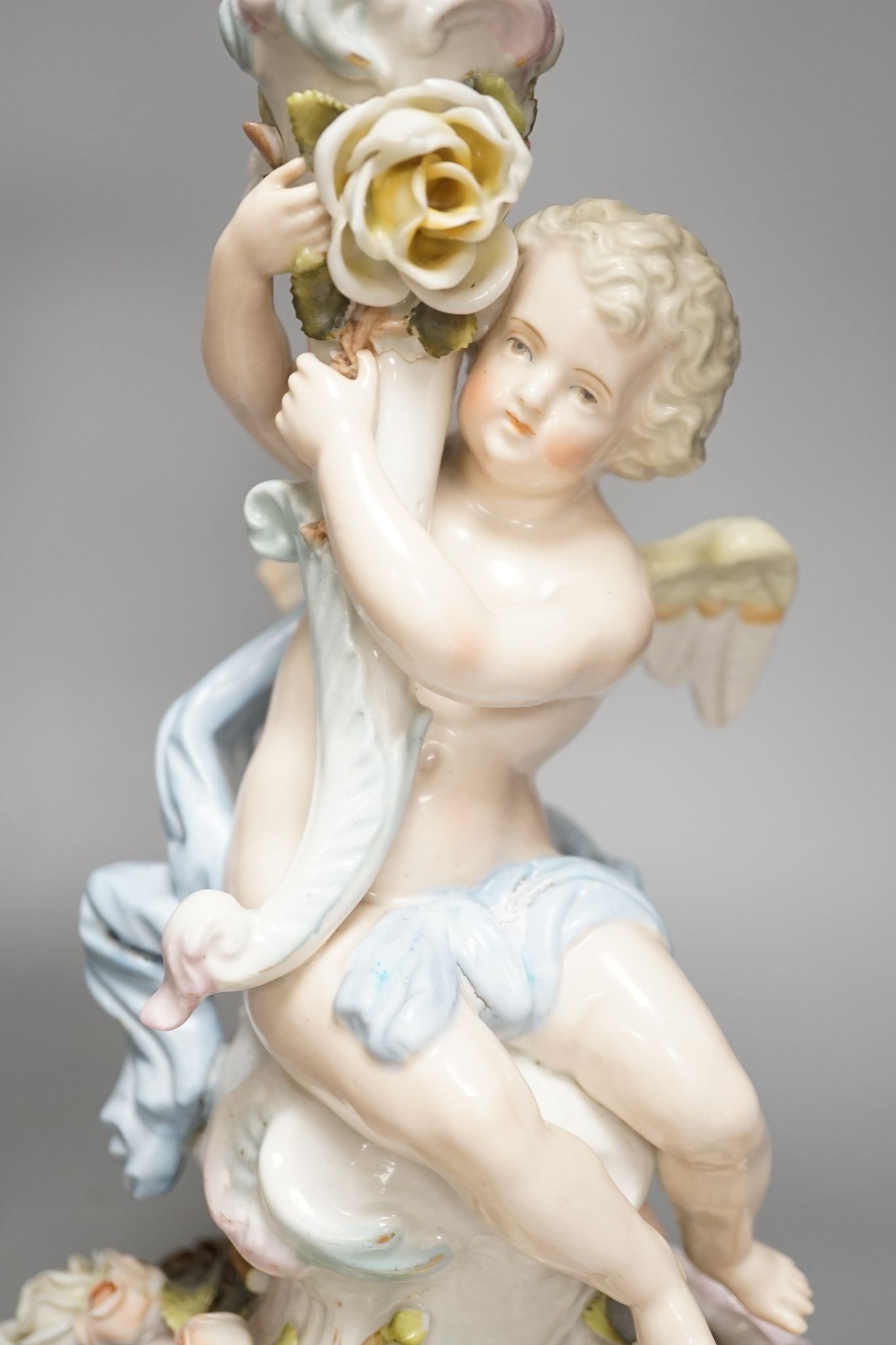 A pair of Sitzendorf 'cherub' candelabra 50cm